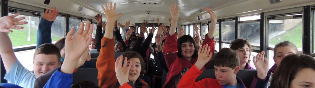 Excited Kids on a School Bus