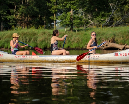 3 girls in a canoe